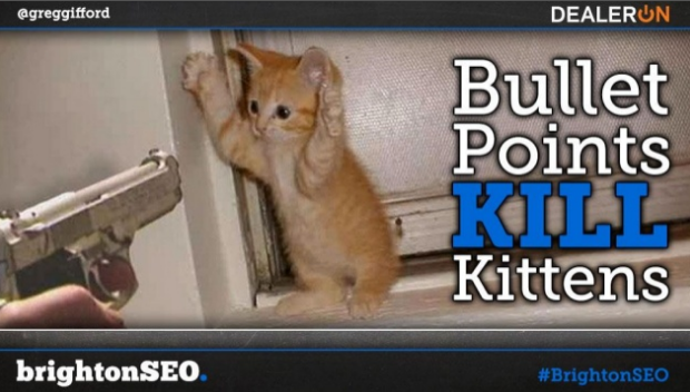Kitten with its hands in the air and a gun pointing at it