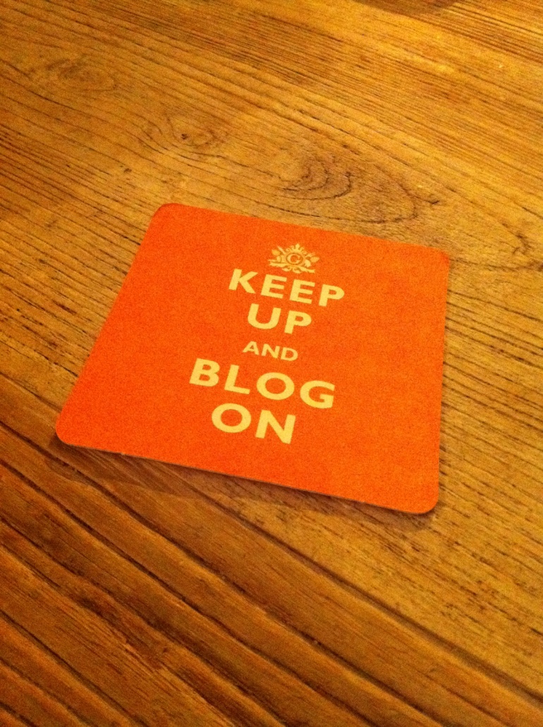 Coaster with text saying 'Keep up and blog on'