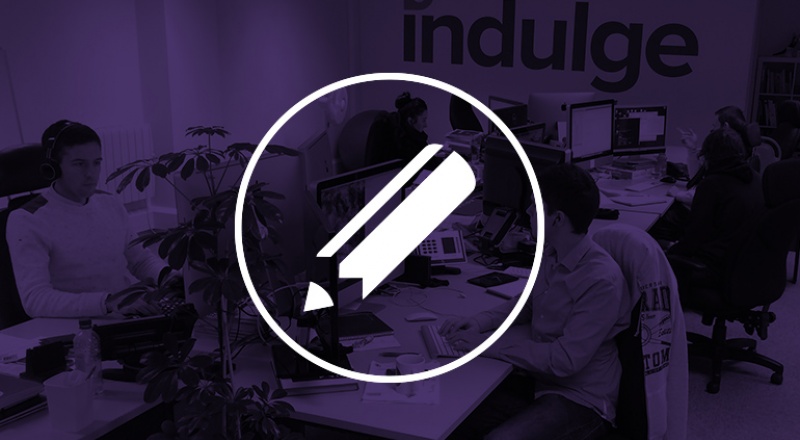 Indulge studio faded out in purple with pen graphic overlaid
